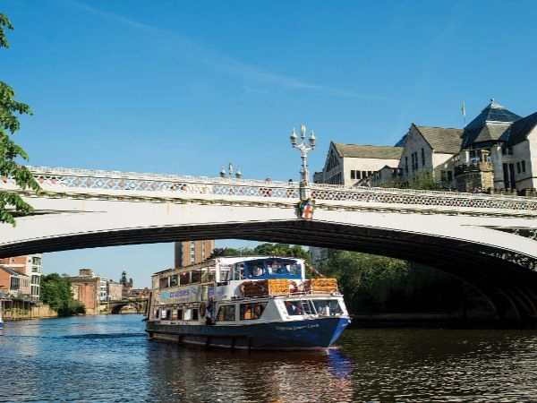 UK family river cruise summer activity Family enjoying a river cruise during a summer staycation in the UK